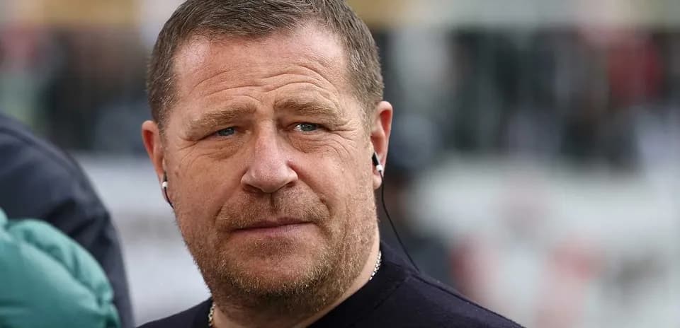 Man with earphones at a sports event