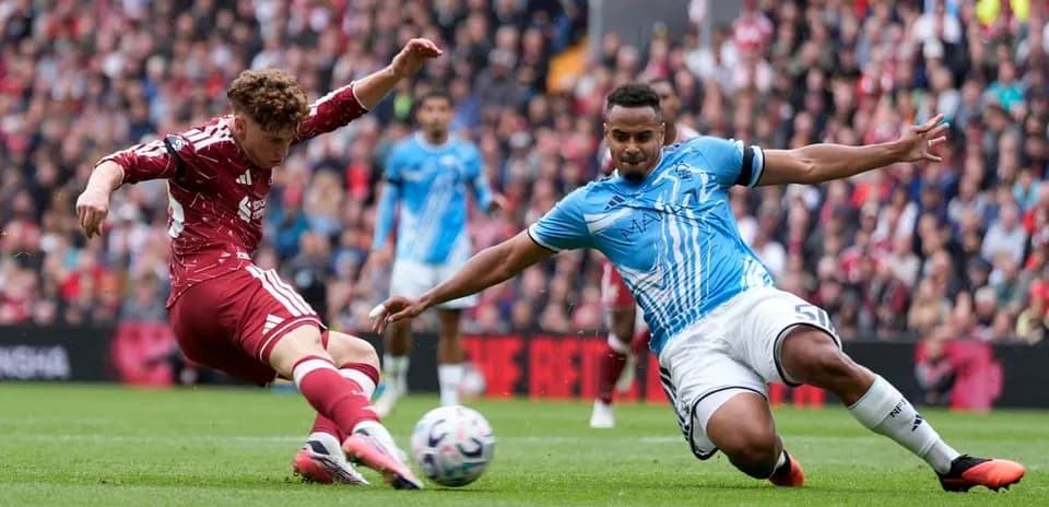 Two players battling for the ball during match