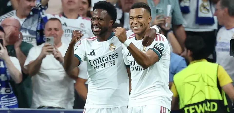 Two Real Madrid players celebrating a goal together