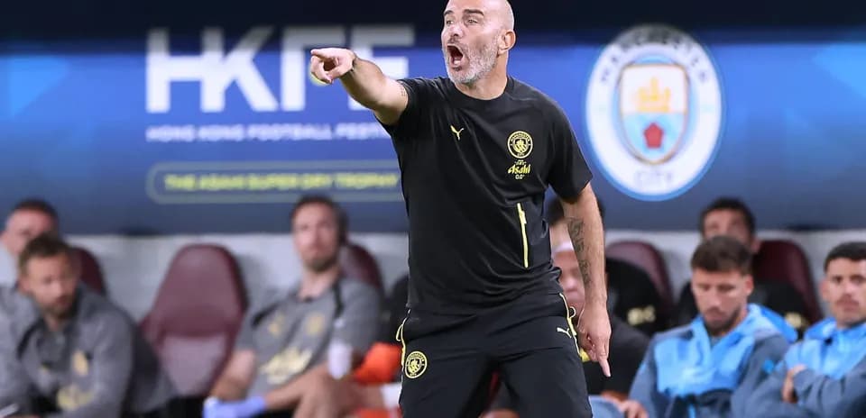 Coach directing players from the sideline during match