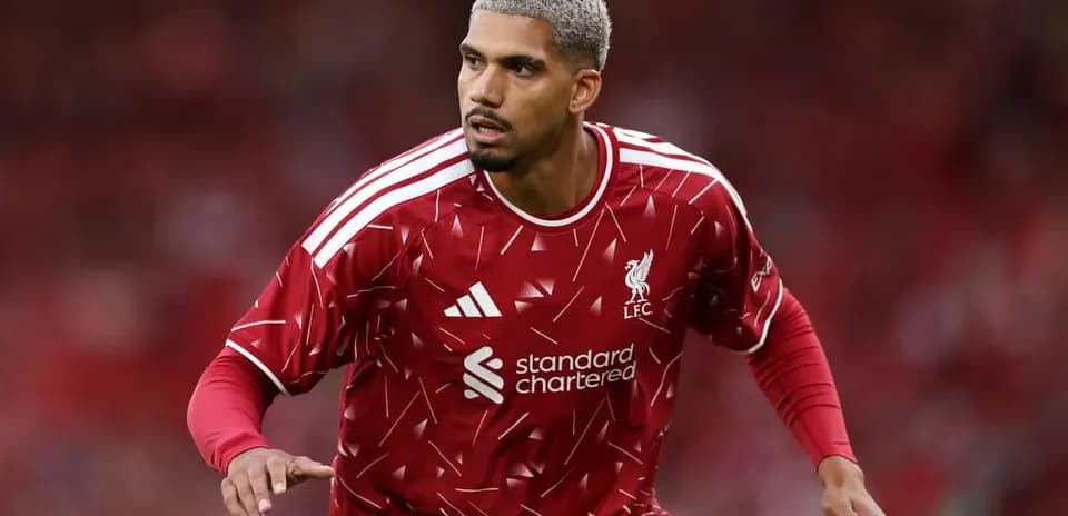 Player wearing Liverpool jersey during match warm-up