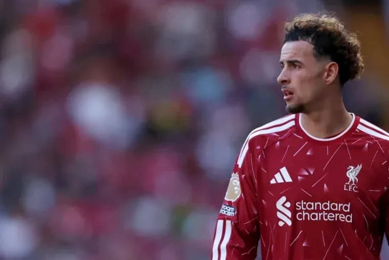 Liverpool player in red kit on the pitch