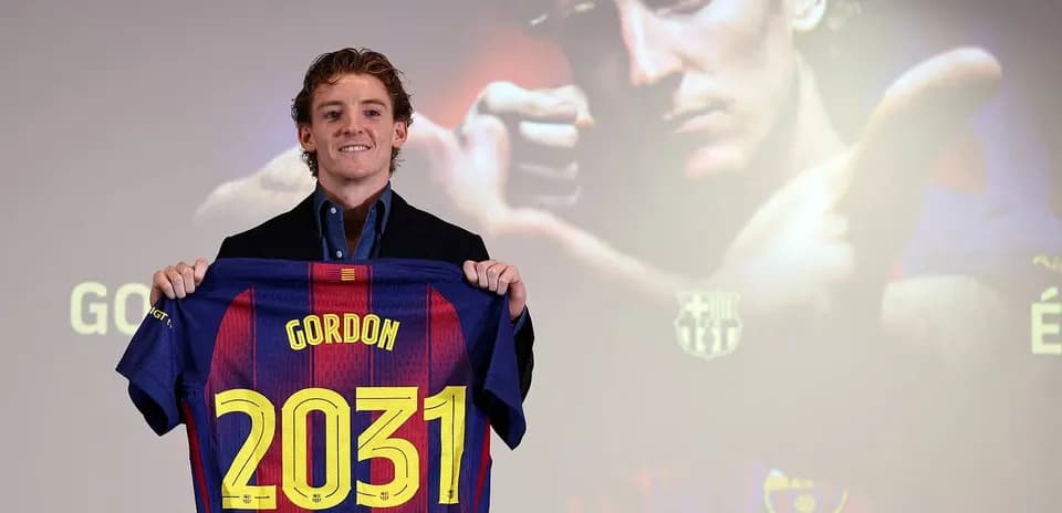 Player holding Barcelona jersey with 'Gordon 2031'