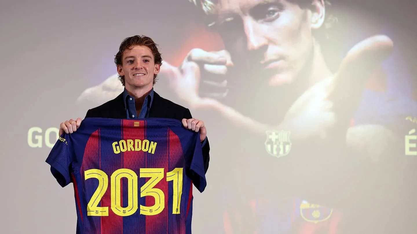 Player holding Barcelona jersey with 'Gordon 2031'