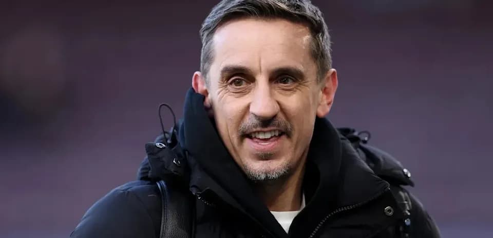 Man in black coat smiling at camera
