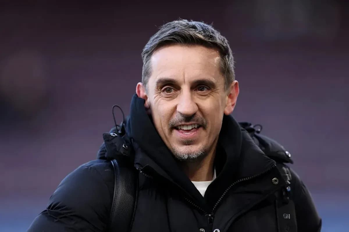Man in black coat smiling at camera