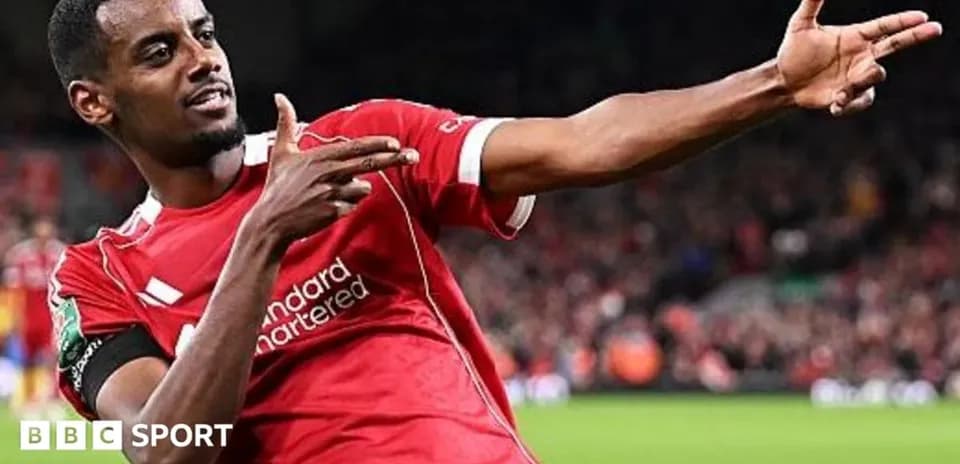Player celebrating a goal in Liverpool jersey