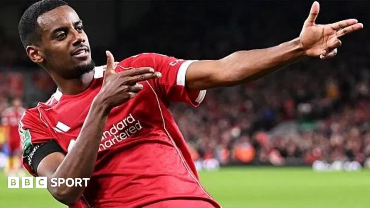 Player celebrating a goal in Liverpool jersey