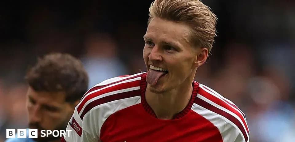 Arsenal player celebrating with tongue out
