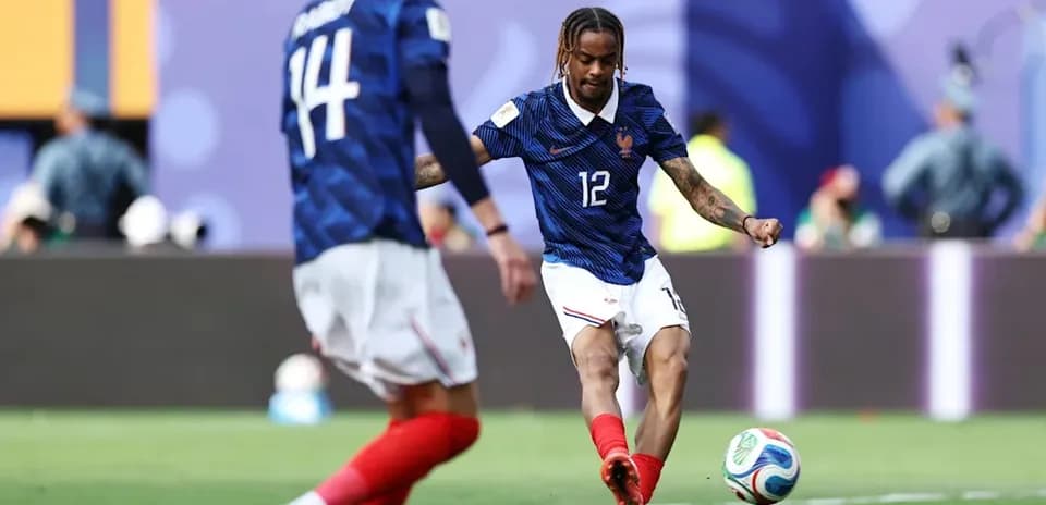 French player kicking the ball during a match
