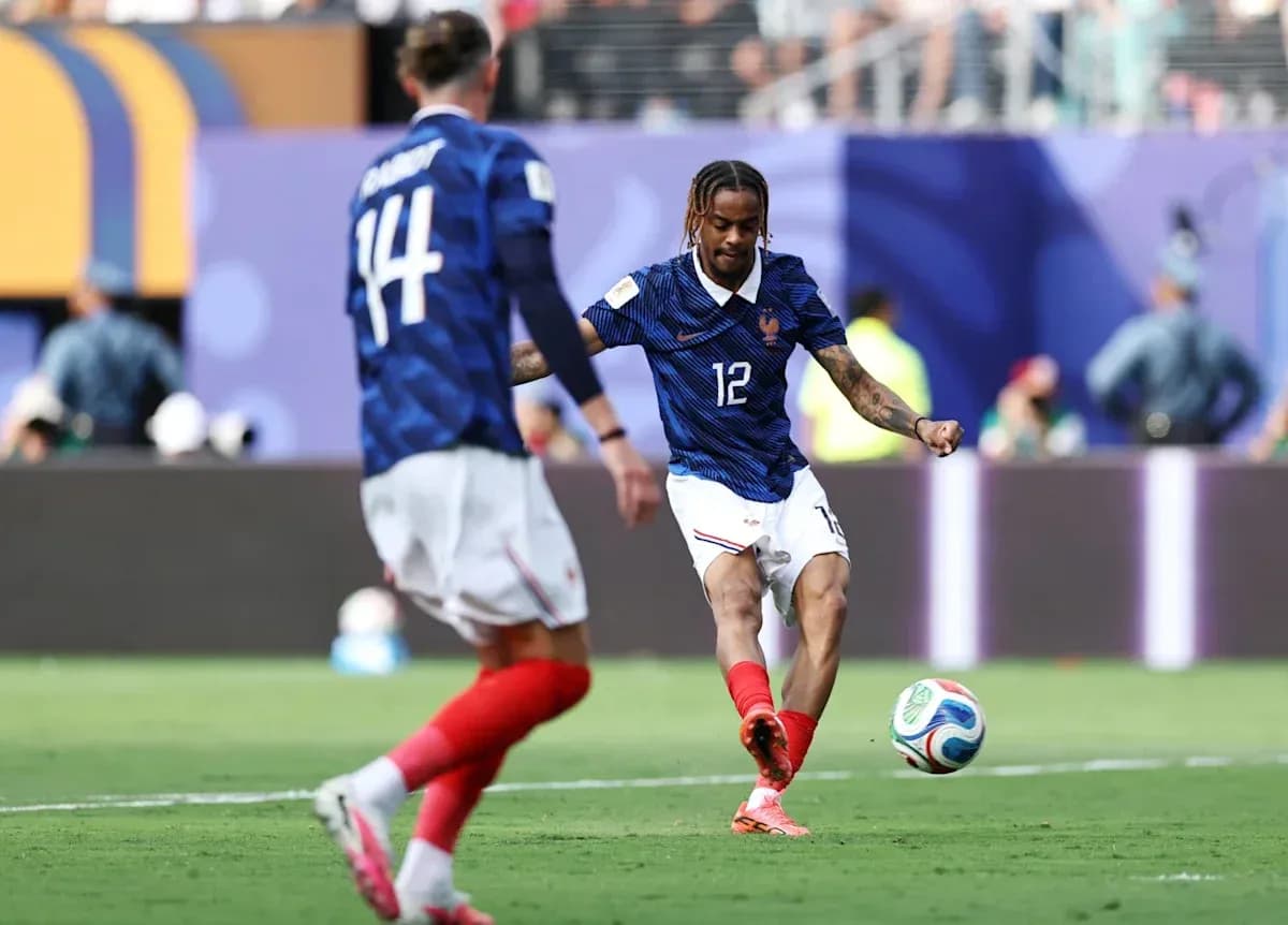 French player kicking the ball during a match