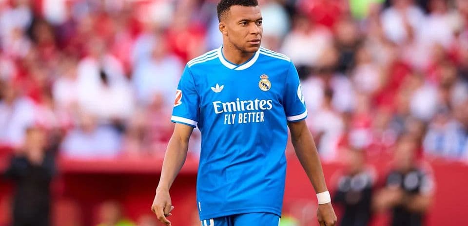 Player in blue Real Madrid jersey on the field