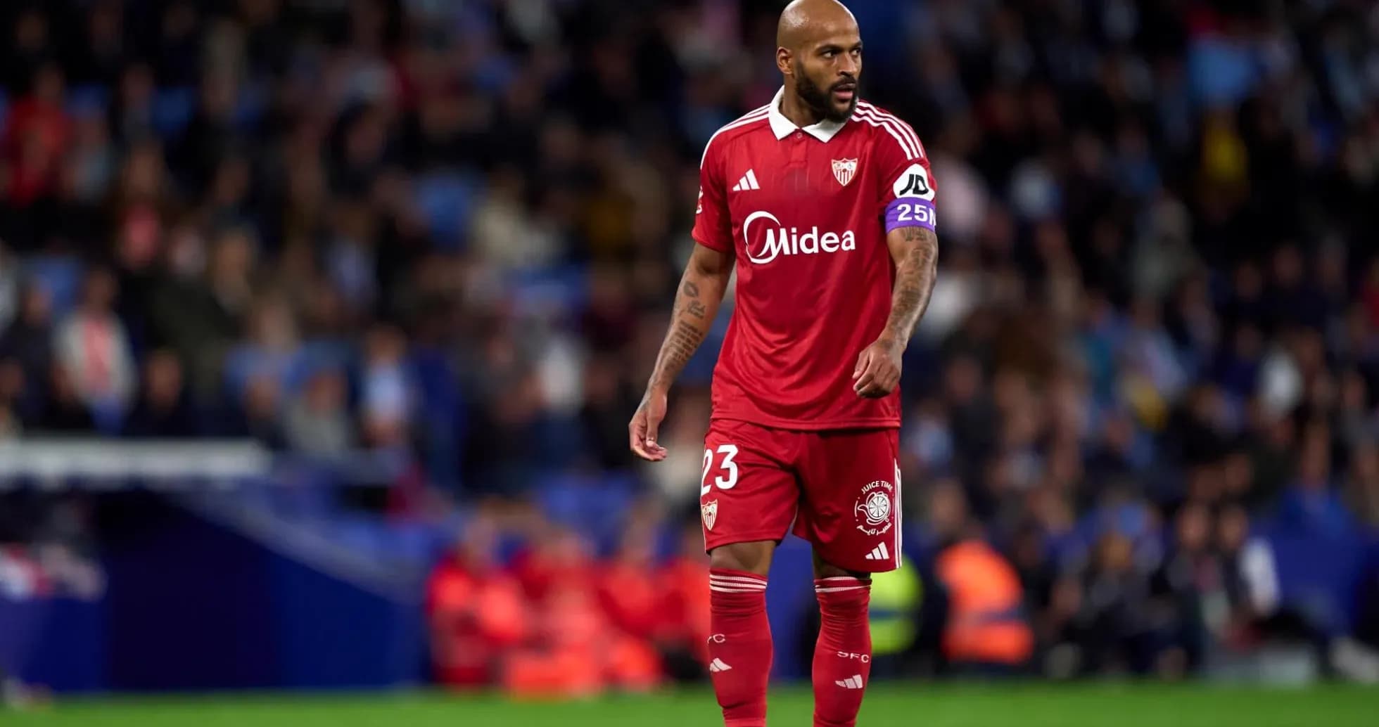 Sevilla player in red jersey on the pitch