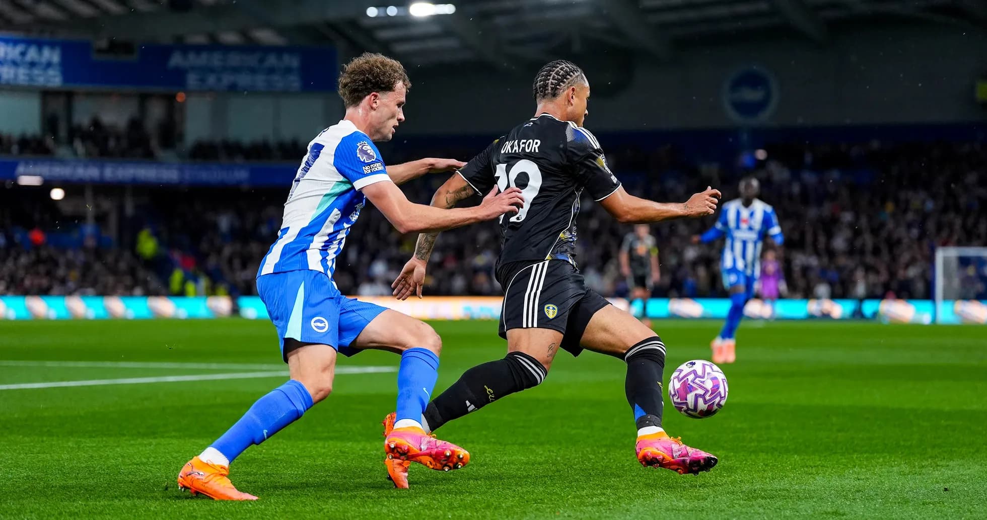 Leeds player challenged by Brighton defender