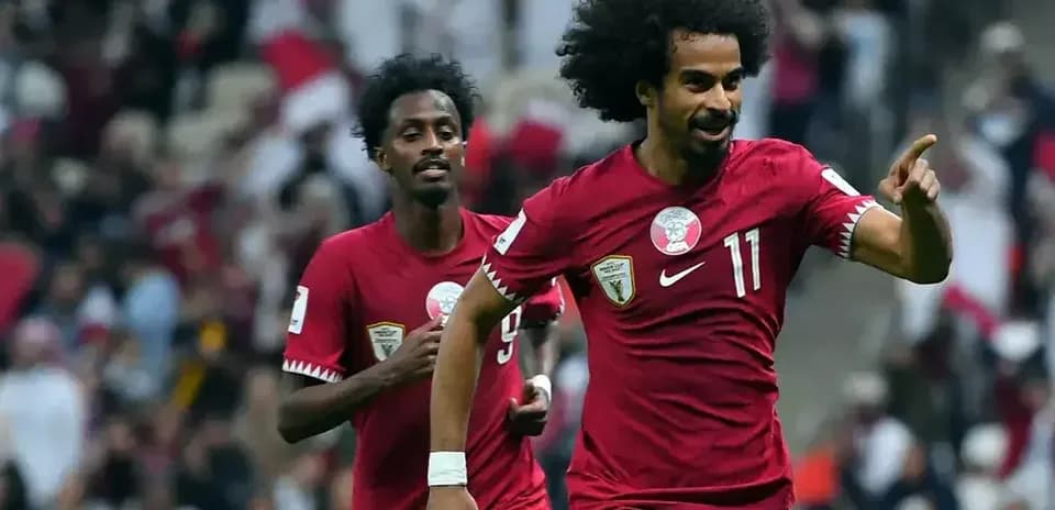 Qatar player celebrating a goal during match