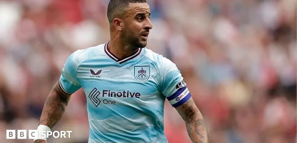 Player in blue kit running on the field