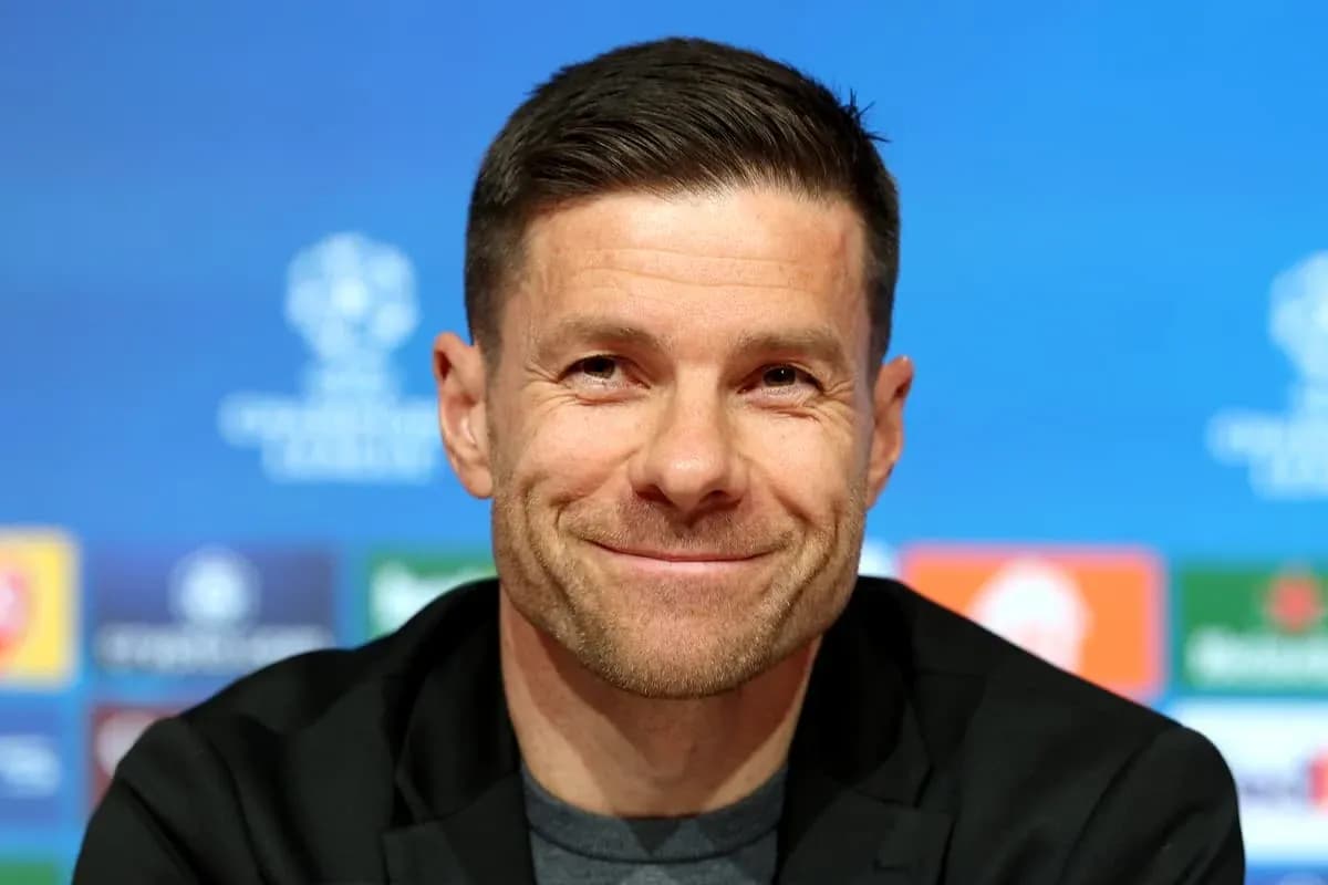 Manager smiling at press conference podium