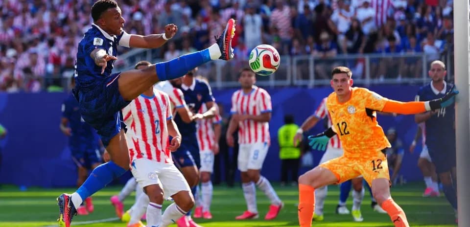Player executing a kick during a football match