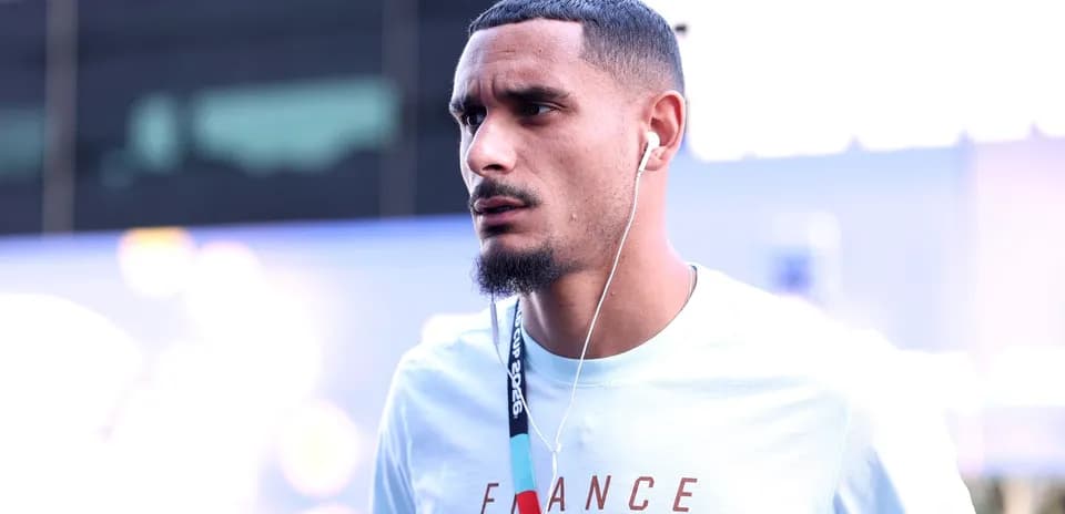 Player wearing headphones, walking towards event venue