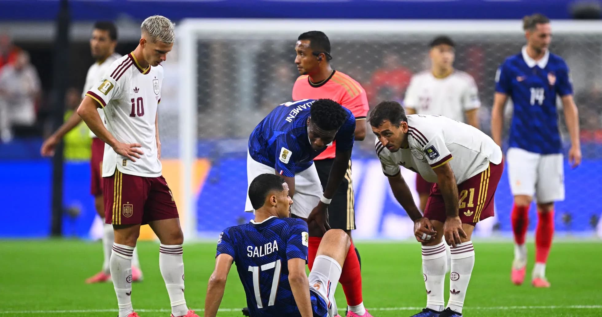 Players attending to injured player on field