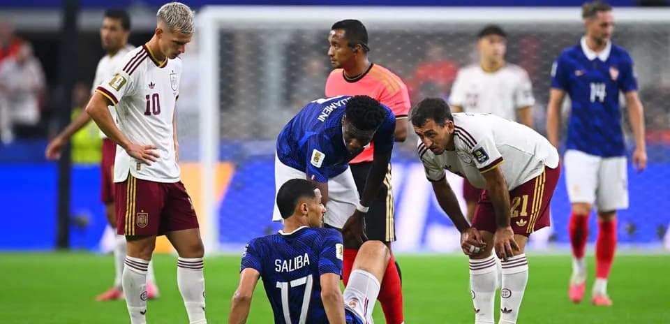 Players attending to injured player on field