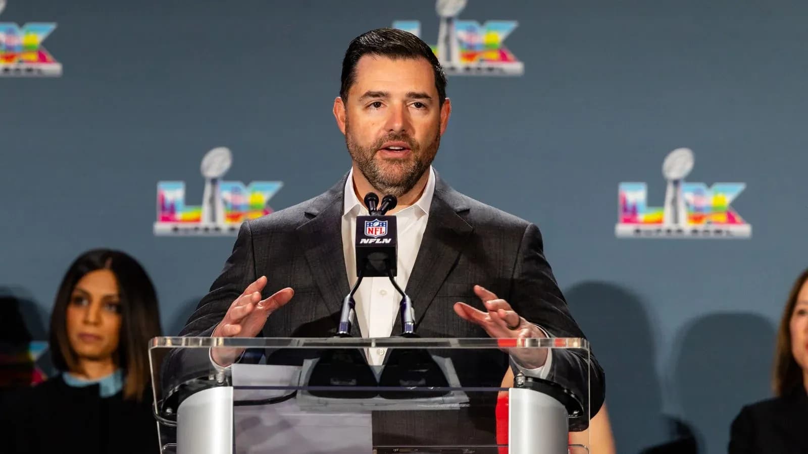 Speaker at podium during NFL press conference