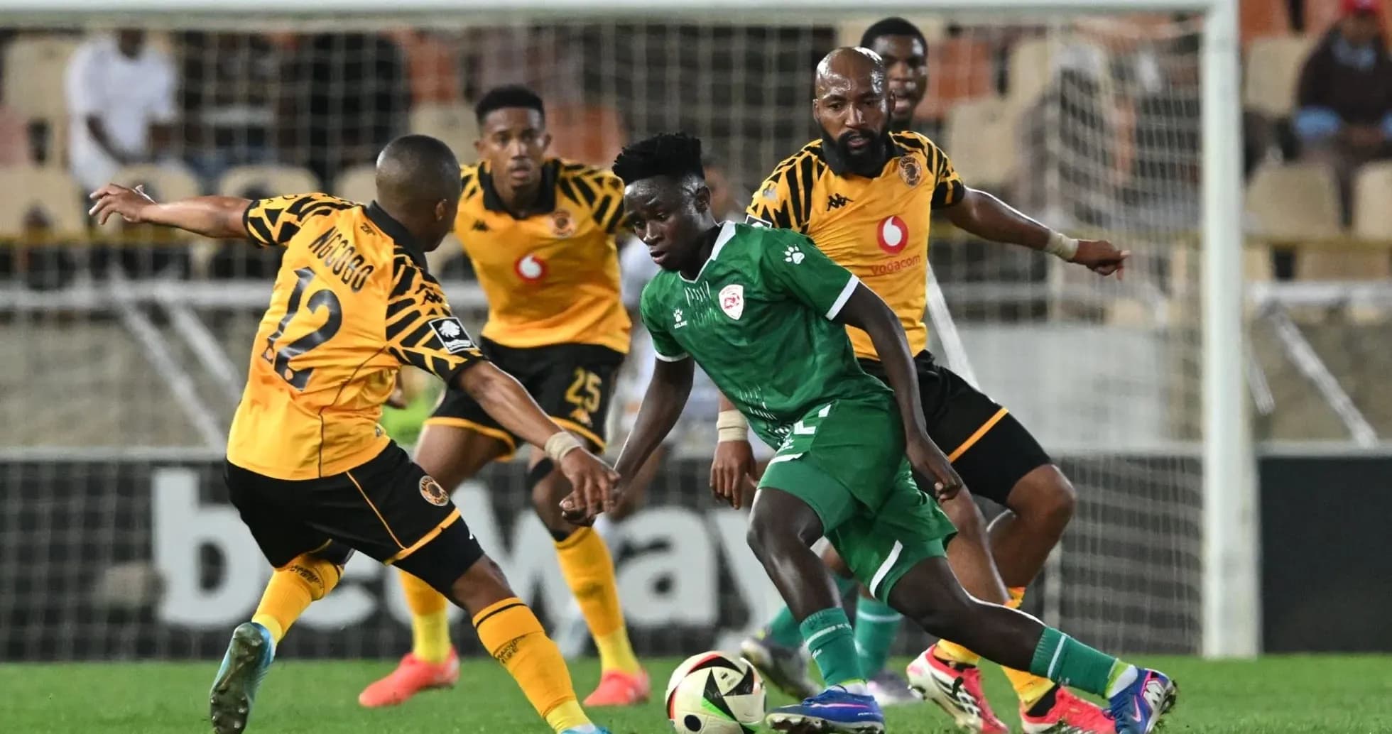 Players contesting possession during a football match