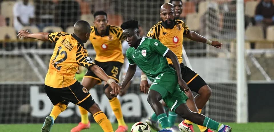 Players contesting possession during a football match