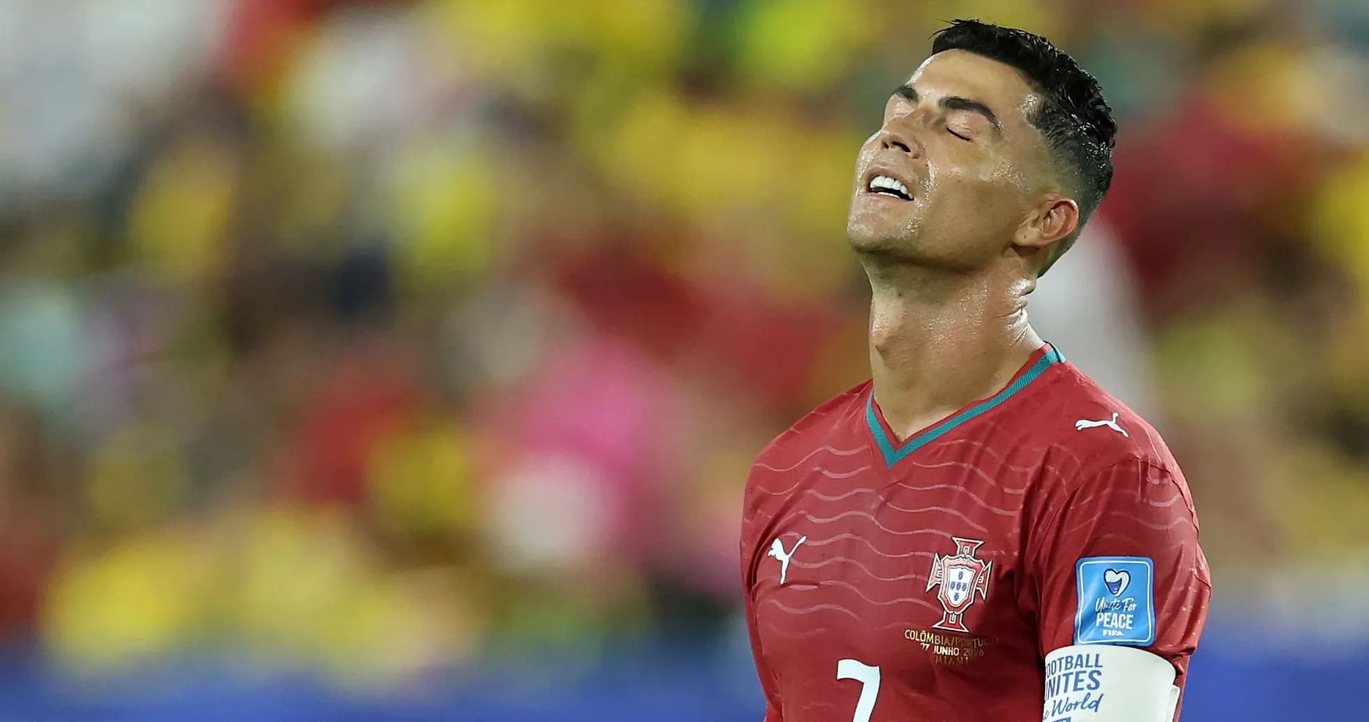 Player in red jersey looking up during match