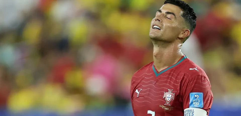 Player in red jersey looking up during match