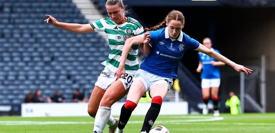 Celtic and Rangers players contesting the ball on field