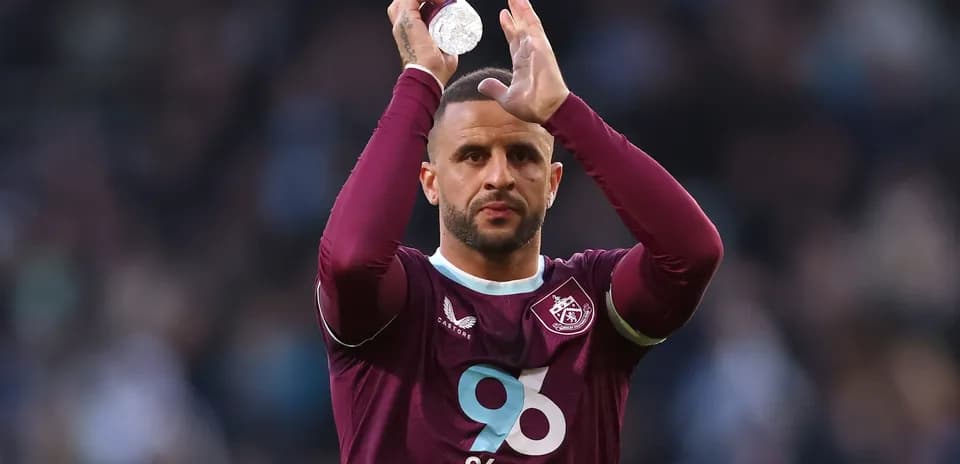 Player applauding fans while holding a bottle