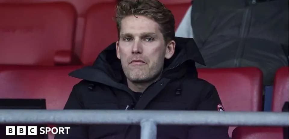 Person seated in stadium during a match
