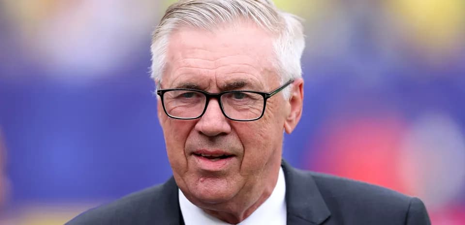 Coach with glasses at a sporting event