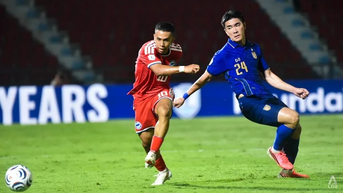 Player 10 dribbling past Player 24 during match