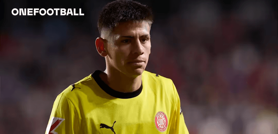 Goalkeeper in yellow kit walking off the pitch