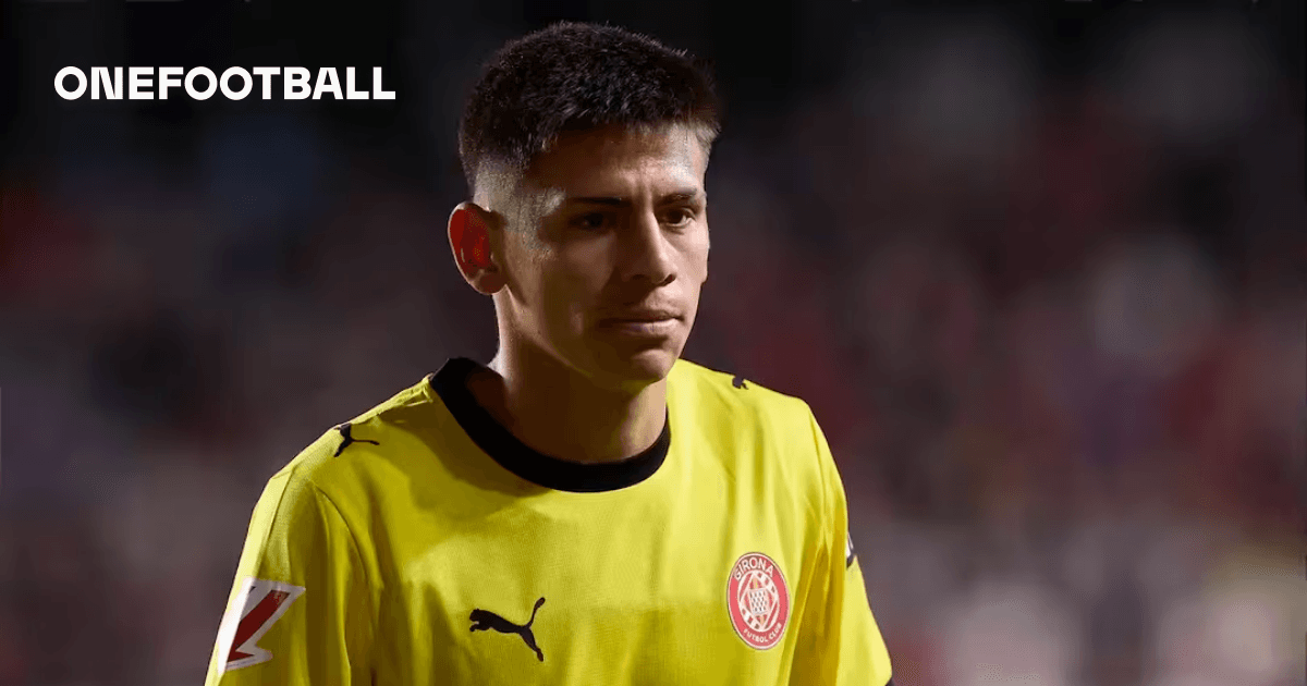 Goalkeeper in yellow kit walking off the pitch