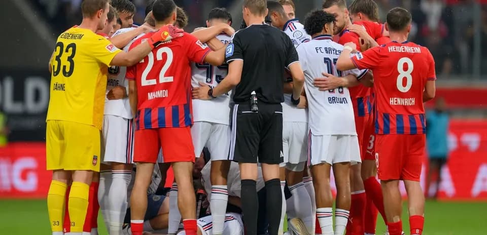 Players from both teams huddled during a stoppage