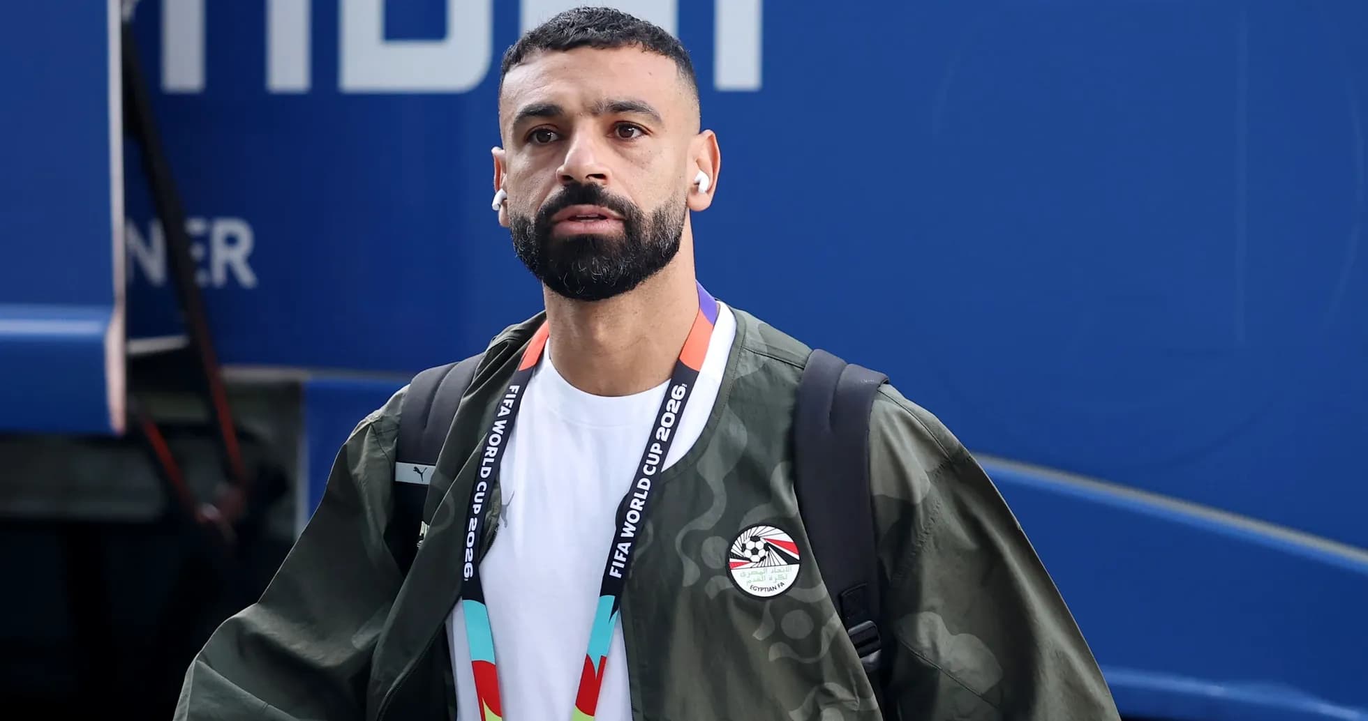 Player arriving at venue wearing team jacket