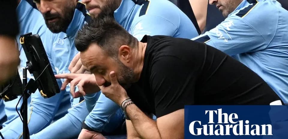 Coaching staff observing match on the sidelines