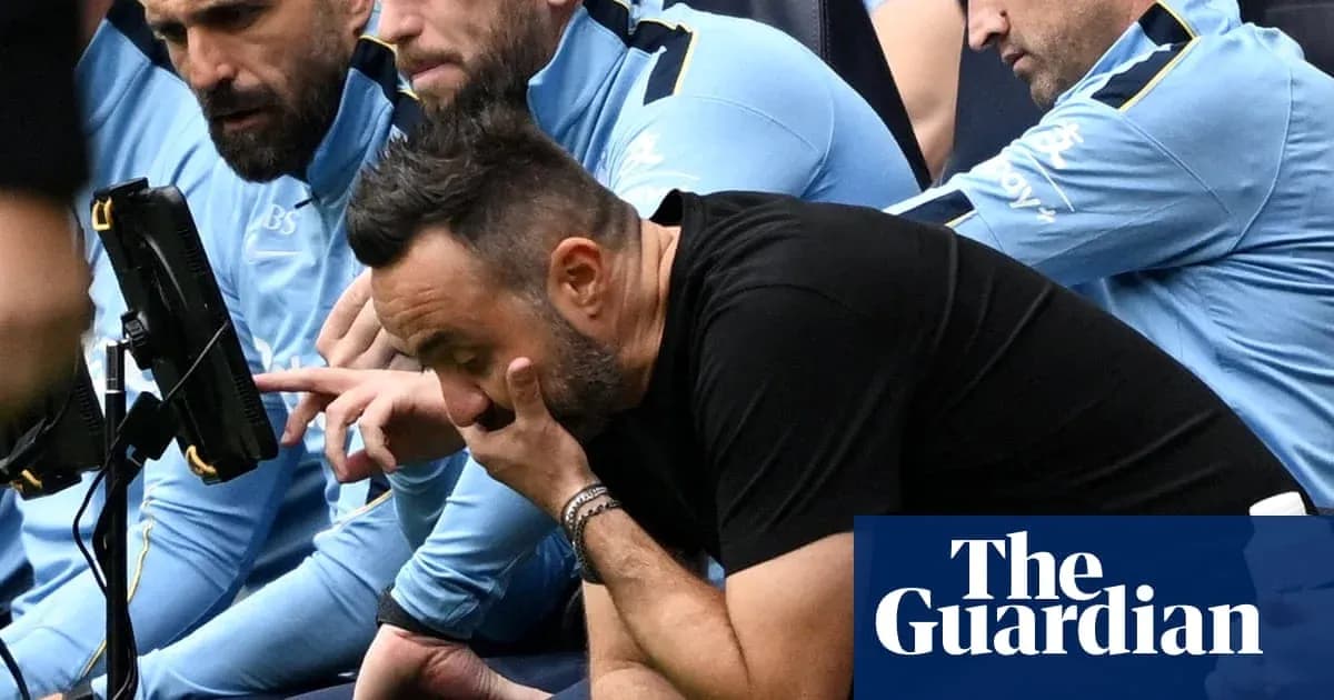Coaching staff observing match on the sidelines