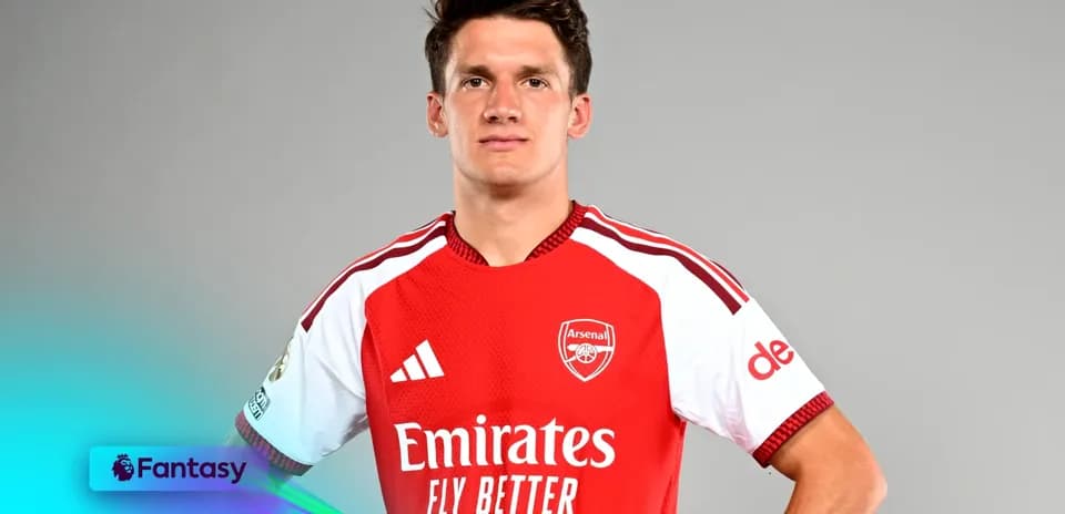 Player posing in Arsenal jersey for promotional shoot