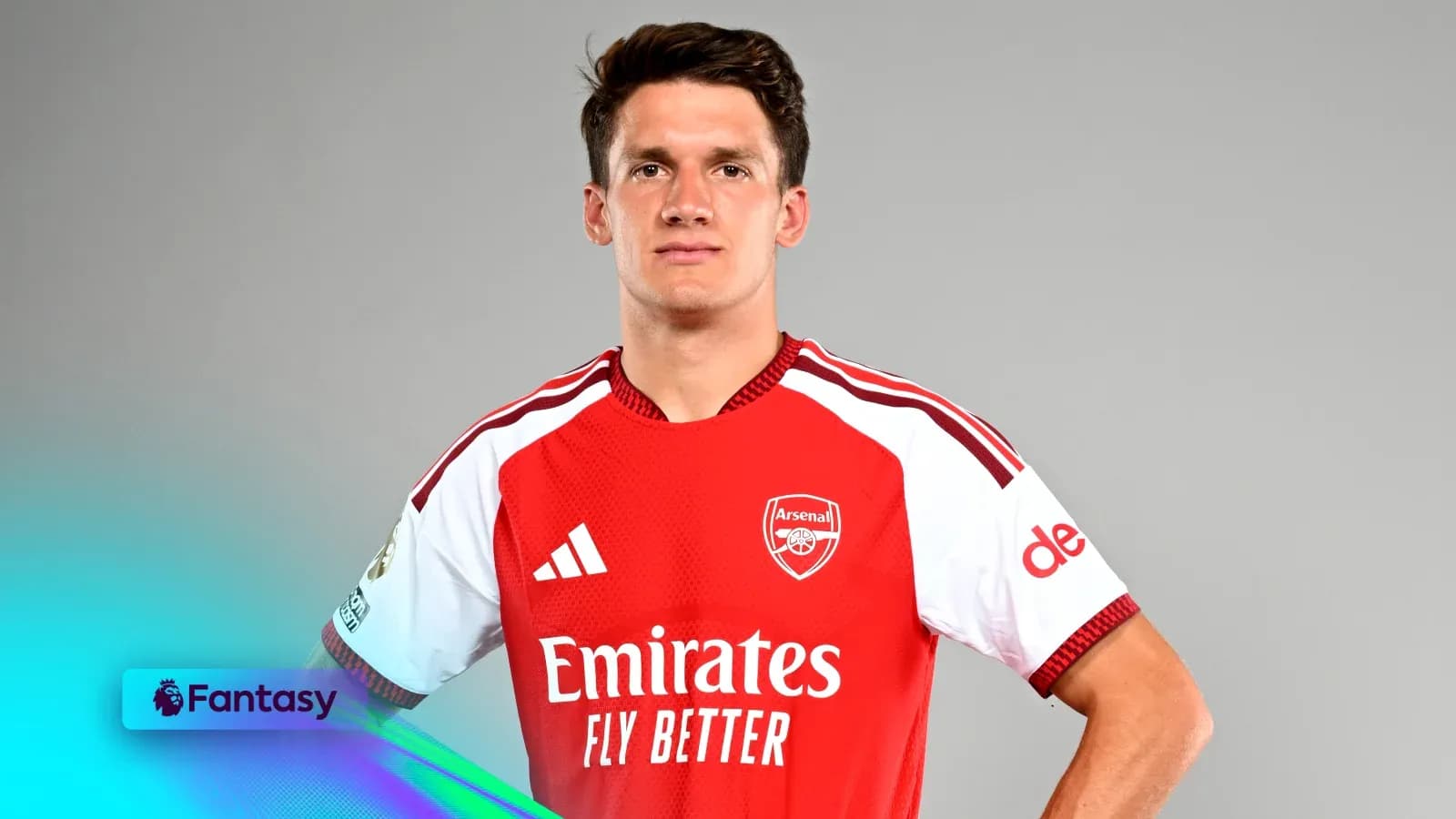Player posing in Arsenal jersey for promotional shoot