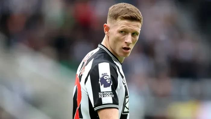 Player in Newcastle United jersey on the pitch