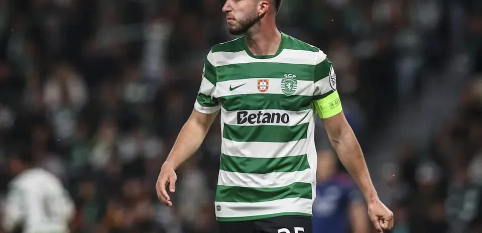 Player in green and white striped jersey on field