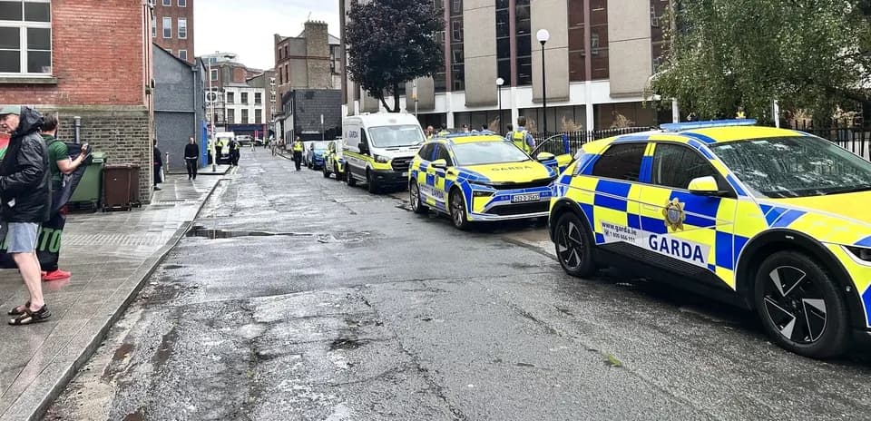 Police vehicles parked on a city street