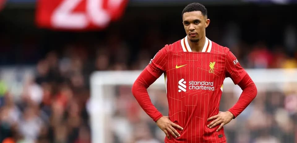 Liverpool player standing on pitch during match