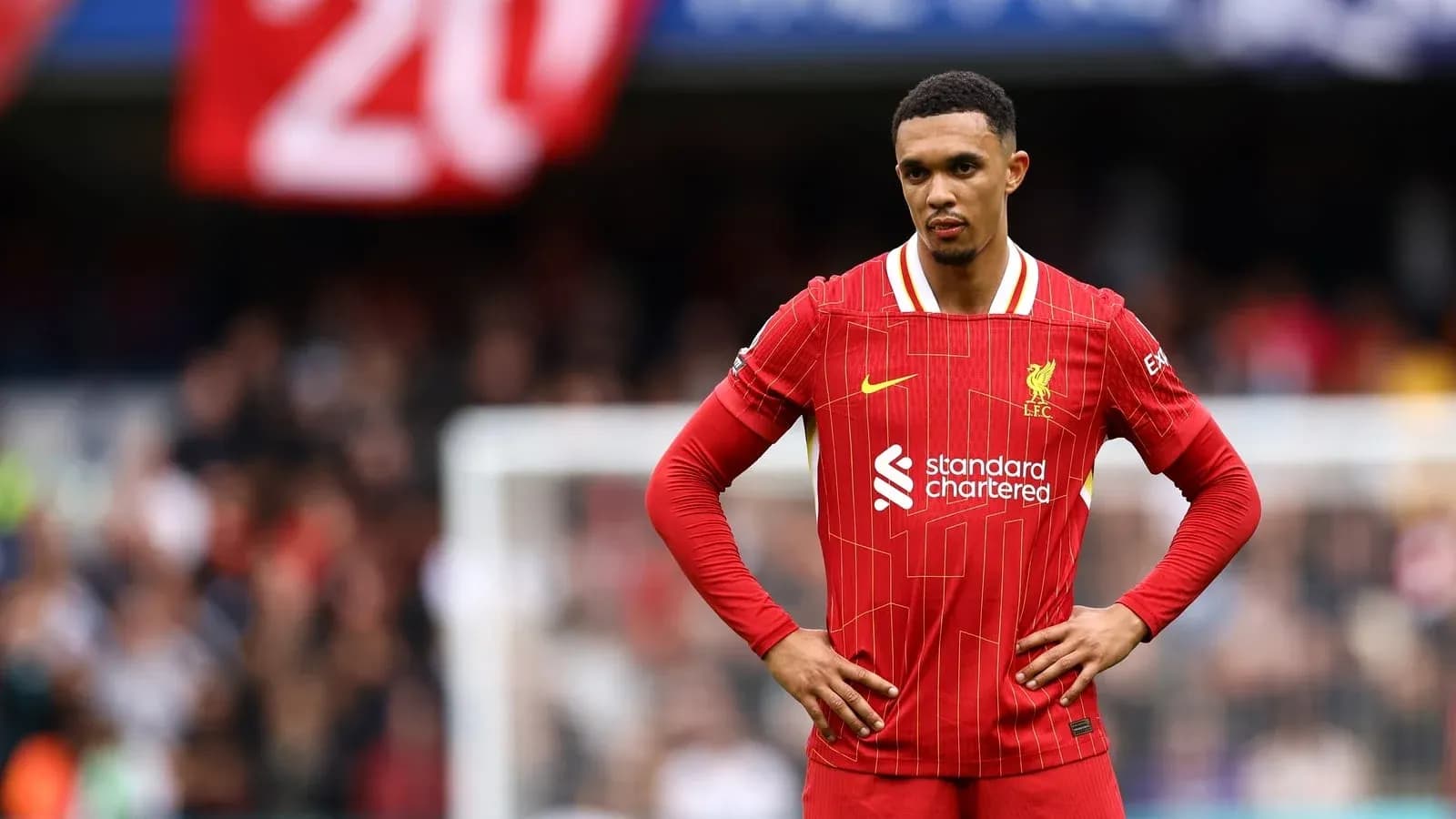 Liverpool player standing on pitch during match