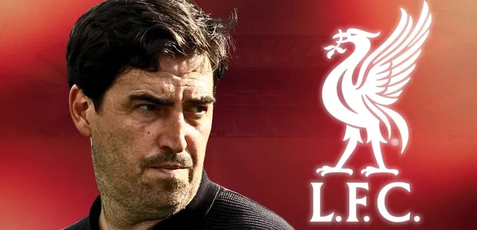 Manager with Liverpool FC logo in background