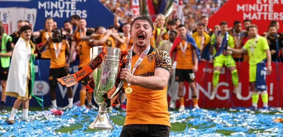 Player celebrating with trophy after winning match